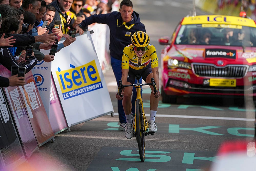 | Photo: AP/Peter Dejong : Tour de France Women cycling race: Stage winner Demi Vollering of The Netherlands reacts as she crosses the finish line after the eighth stage